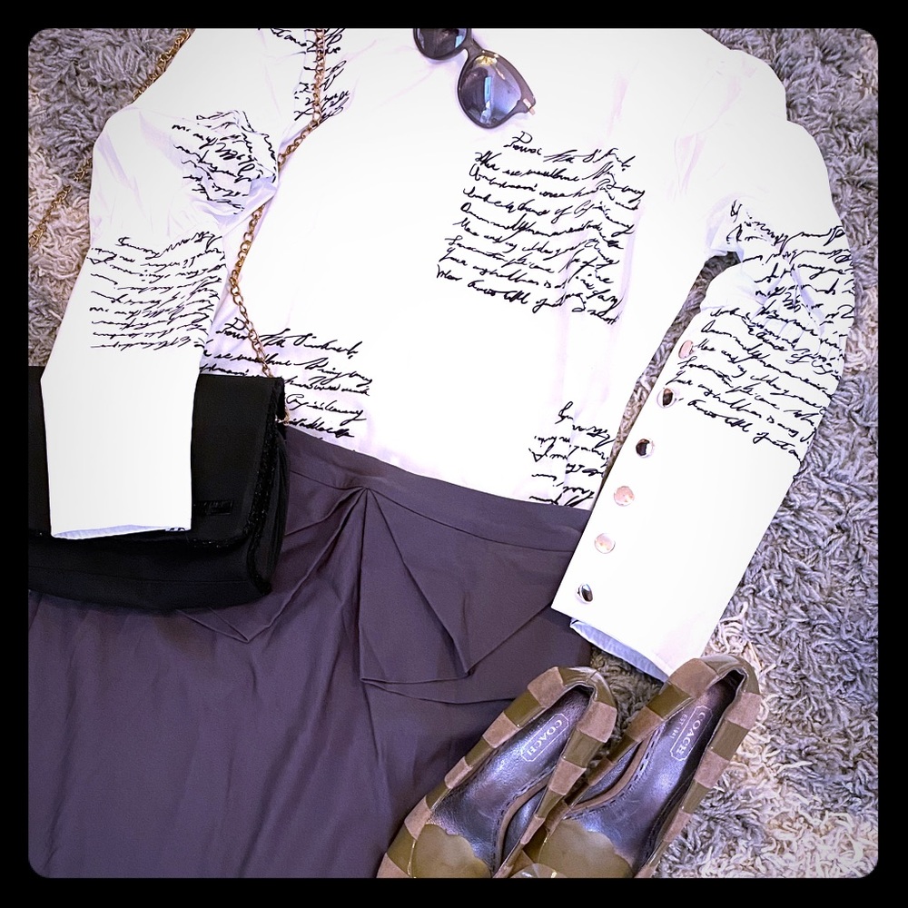 White blouse black script and rose gold buttons